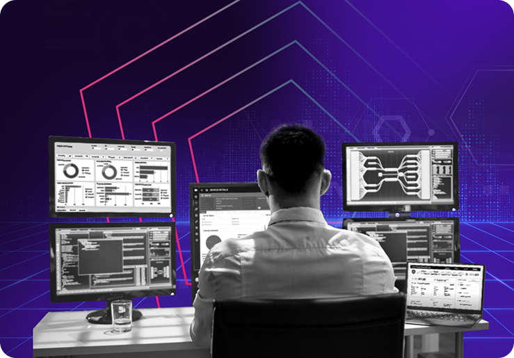 IT professional seated at a desk monitoring multiple screens displaying dashboards, system metrics, and network diagrams against a purple tech-themed background