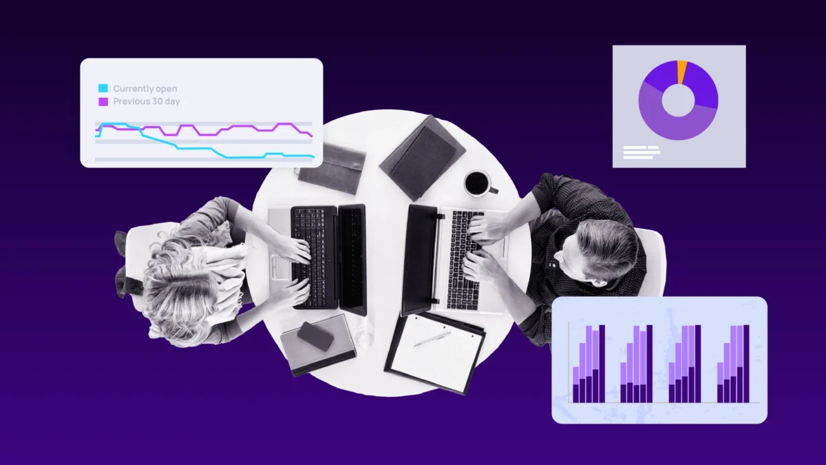 IT professionals reviewing incident management metrics and performance dashboards on laptop computers.